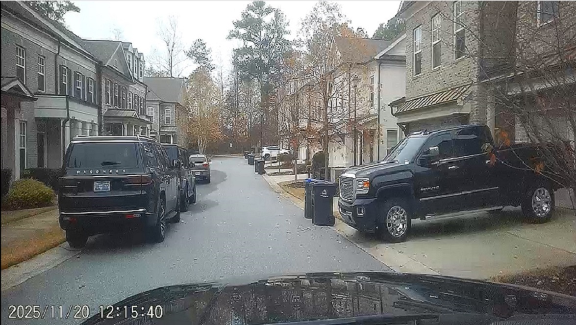 The entire westbound lane of traffic is being blocked by the cars illegally parked on the left side of this photograph - Thanks Christina Gunn! Thanks Kobe Crouch! Thanks Mike Dubas!